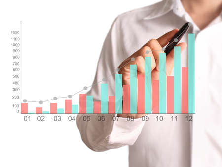 Man hand drawing a chart showの写真素材