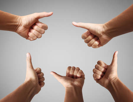 Humans hands, showing thumbs, OK signの写真素材