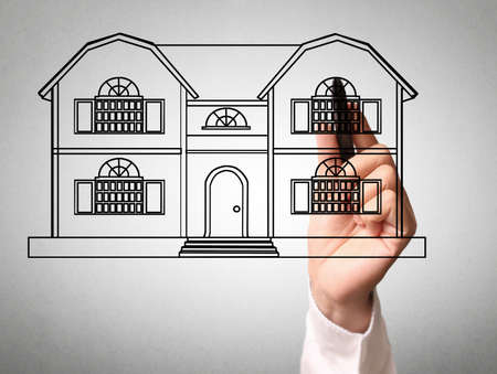 Hand drawing a house modelの写真素材