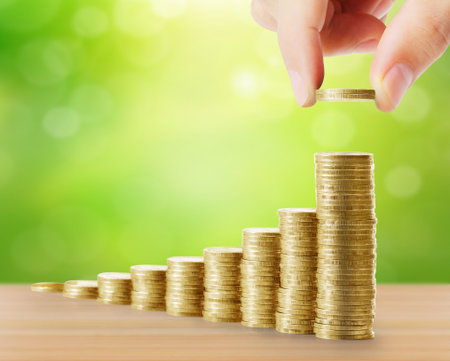Hand human hand putting coin to money, business ideas