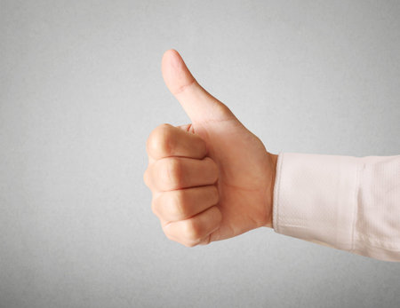 Business man hand with thumb up