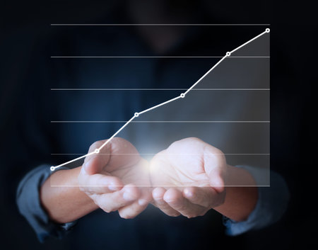 Graphs in the hand, meeting conceptの写真素材