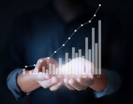 Graphs in the hand, meeting conceptの写真素材