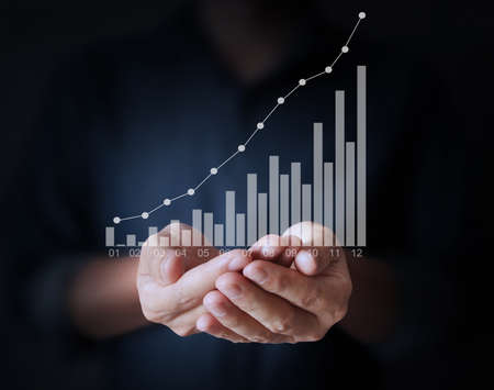 Graphs in the hand, meeting conceptの写真素材