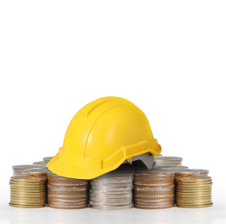 Yellow helmet plastic safety on a coins
