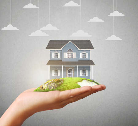 holding home model, loan conceptの写真素材