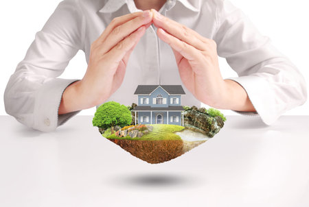 Mortgage concept by house from in handの写真素材