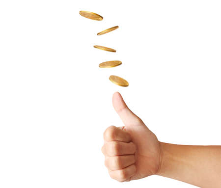 hand throwing up a coin to make  decisionの写真素材