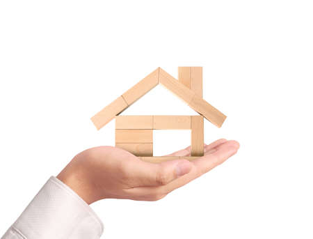 Mortgage concept by house from in handの写真素材