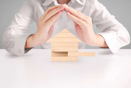 Mortgage concept by house from in handの写真素材