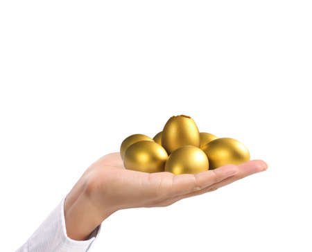 Businessman Holding of golden eggsの写真素材