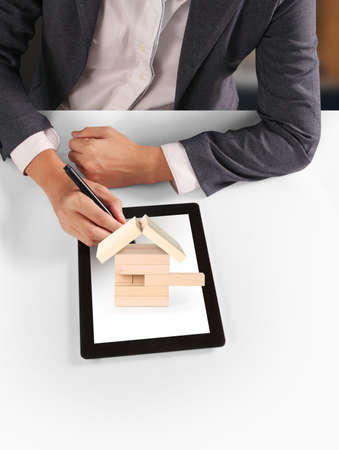 hands holding and pointing  contemporary digital tablet

の写真素材