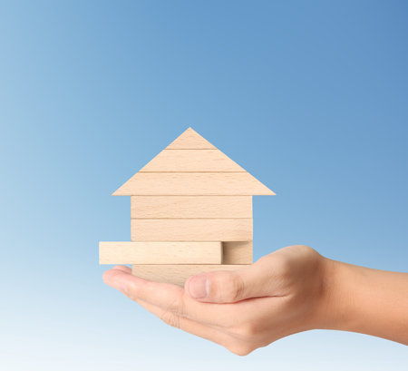 Mortgage concept by house from in handの写真素材