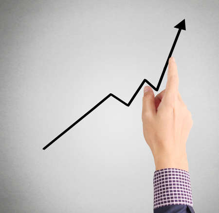 nvestment concept,businessman with financial symbols coming from handの写真素材