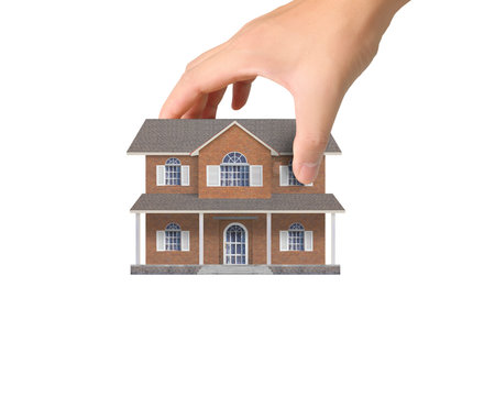 Mortgage concept by house from in handの写真素材