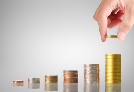 Hand human hand putting coin to money, business ideas