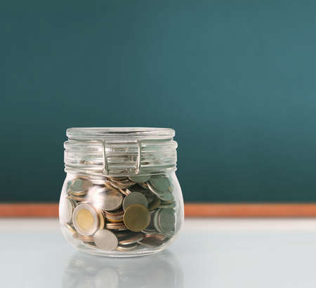 Silver coins in a piggy bank Glassの写真素材
