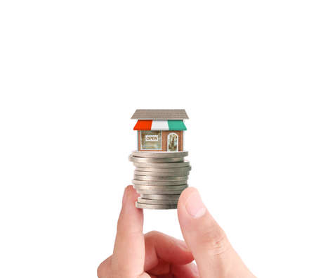 Hand human hand putting coin to money, business ideasの写真素材