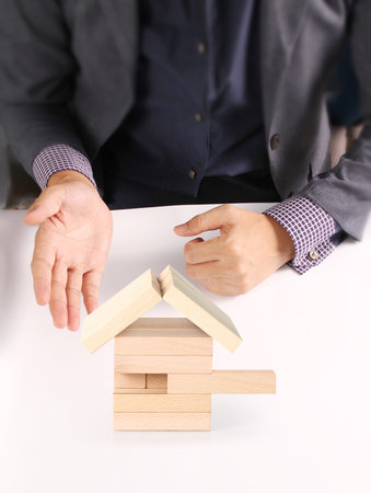 Mortgage concept by house from in handの写真素材