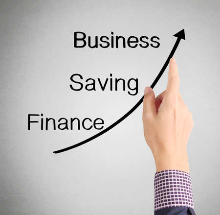 nvestment concept,businessman with financial symbols coming from handの写真素材