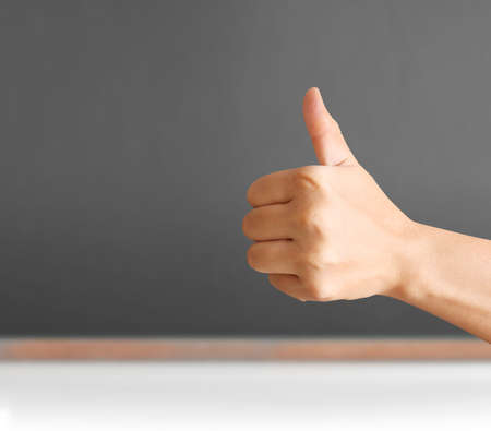 Hand shown thumb up isolatedの写真素材