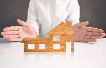 Mortgage concept by house from in handの写真素材