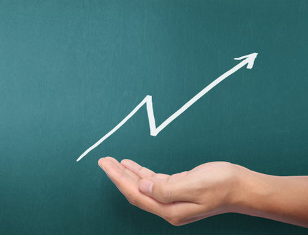 drawing results graph with white chalk on blackboardの写真素材