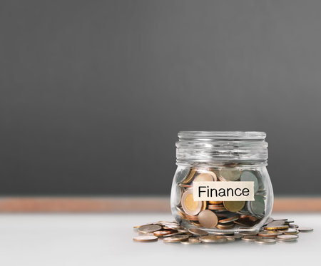 Silver coins in a piggy bank Glassの写真素材