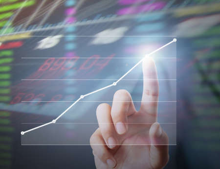 Investment concept,businessman with financial symbols coming from handの写真素材