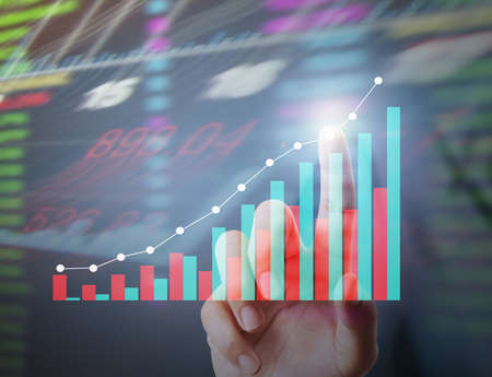 Investment concept,businessman with financial symbols coming from handの写真素材