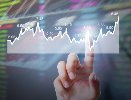 Investment concept,businessman with financial symbols coming from hand