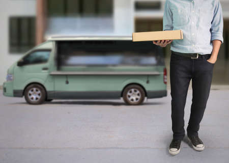 Delivery man near a shipping truckの写真素材