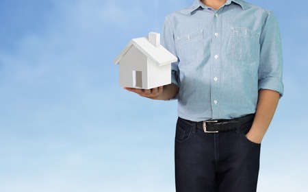 Mortgage concept by house from in handの写真素材