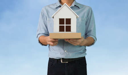 Mortgage concept by house from in hand の写真素材