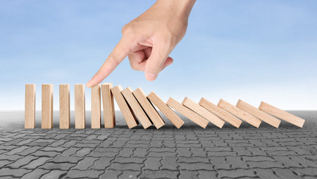 stop a dominoes continuous toppled