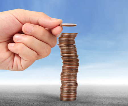 Concept of money growing from coins in handの写真素材