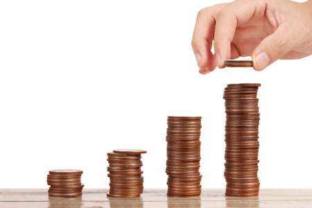 Concept of money growing from coins in handの写真素材