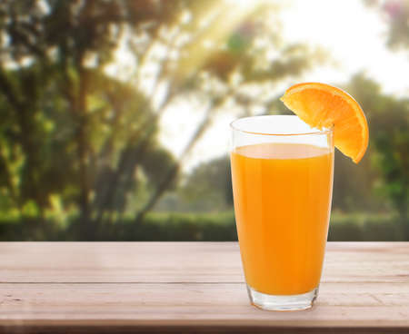 orange  on white a wooden tableの写真素材