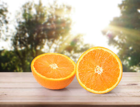 orange  on white a wooden tableの写真素材