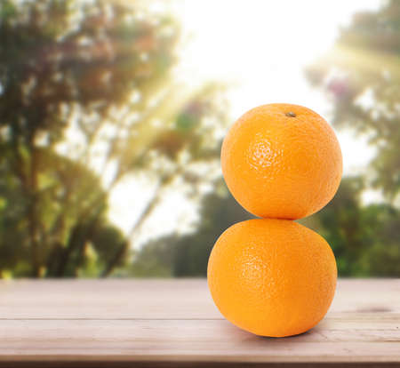 orange  on white a wooden tableの写真素材