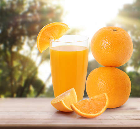 orange  on white a wooden tableの写真素材