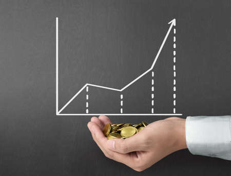 drawing results graph with white chalk on blackboardの写真素材