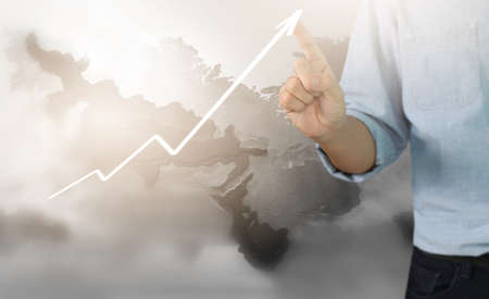 Businessman plan graph growth and increase of chart positive indicators in his businessの写真素材