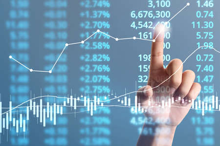 Businessman plan graph growth and increase of chart positive indicators in his businessの写真素材