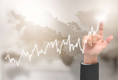 Businessman plan graph growth and increase of chart positive indicators in his businessの写真素材