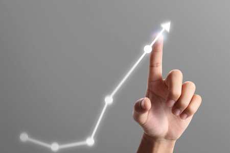 Businessman plan graph growth and increase of chart positive indicators in his business