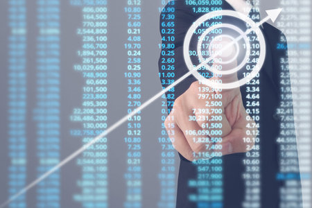 Businessman plan graph growth and increase of chart positive indicators in his businessの写真素材