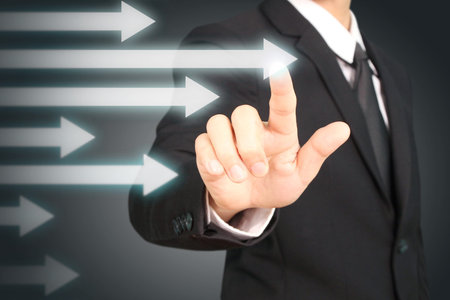 businessman with financial symbols coming from hand ,touch chart stockの写真素材