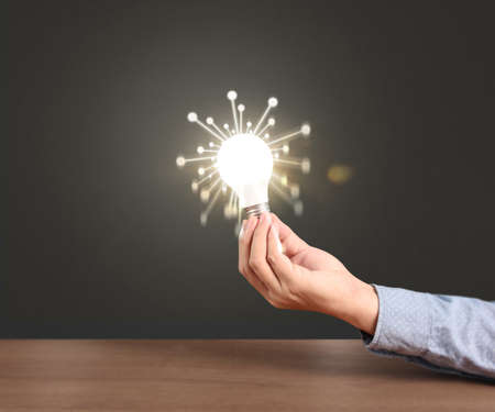 holding lightbulb in a handの写真素材