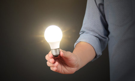 holding lightbulb in a handの写真素材